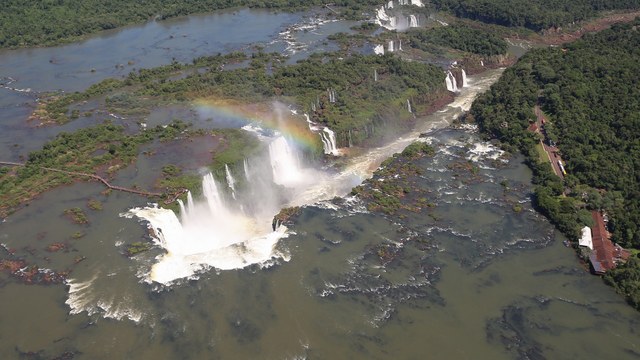 Aerial view of the Devil's Throat and the Iguaçu Falls with a rainbow
