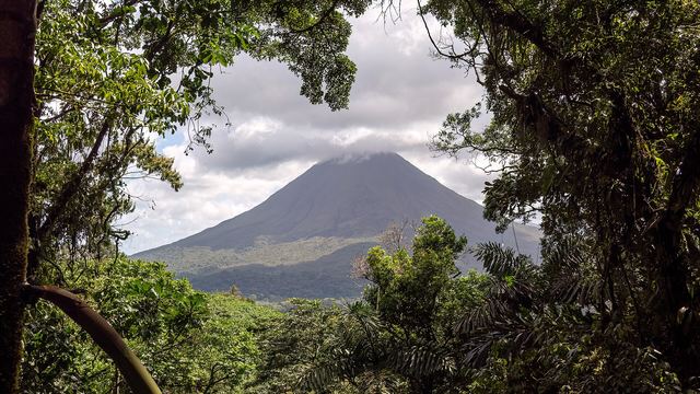 Arenal Volcano framed by rainforest