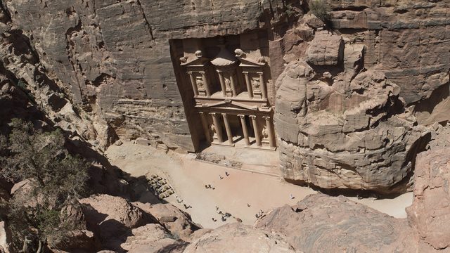 The Treasury (Al-Khazneh) of Petra seen from above, with the square and the rock walls of the Siq