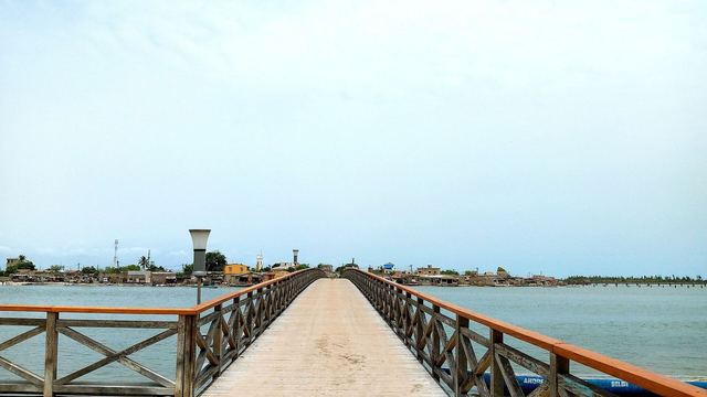 The long wooden bridge to the shell island of Fadiouth