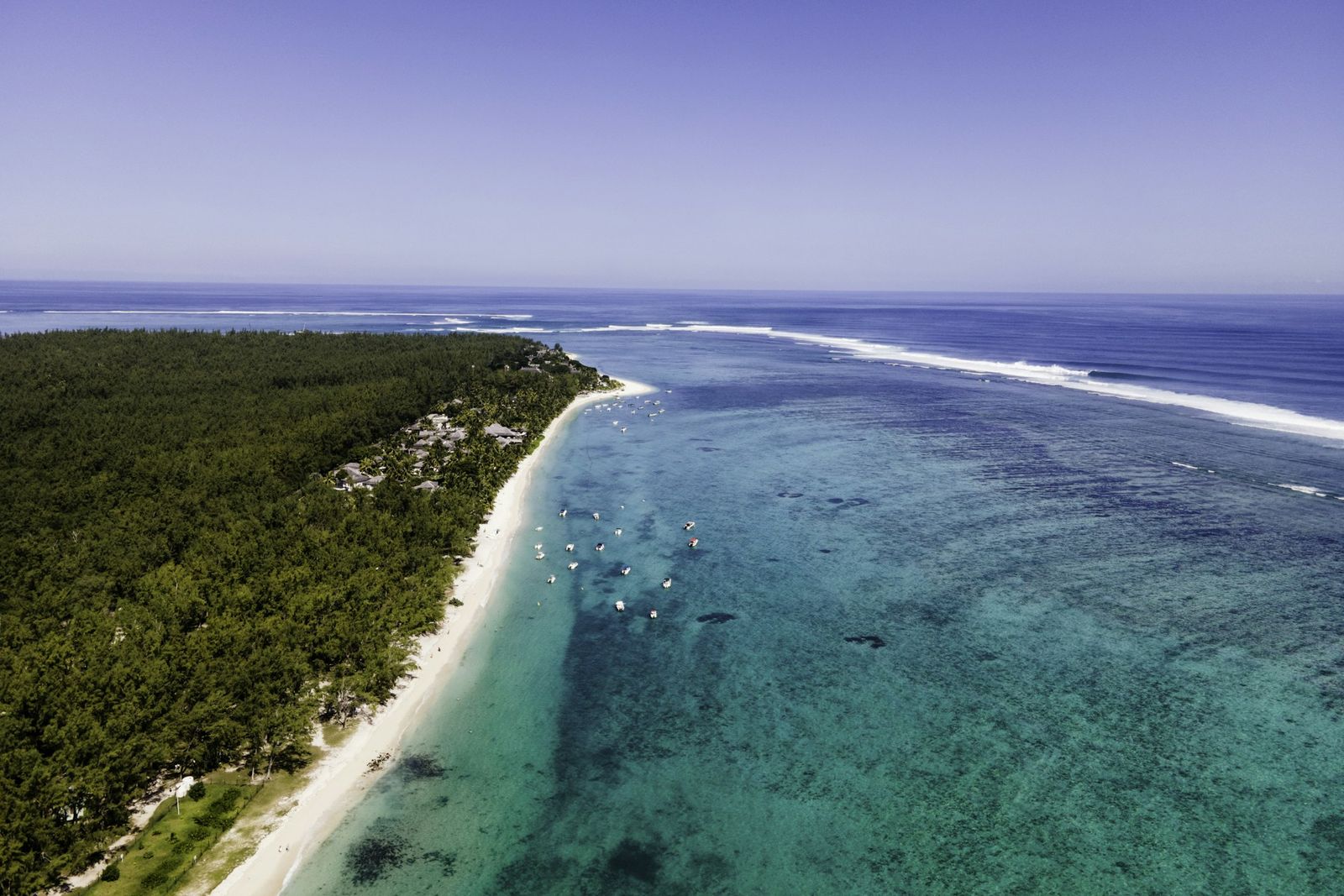 Aerial view of a white beach and a turquoise lagoon at Le Morne, Mauritius